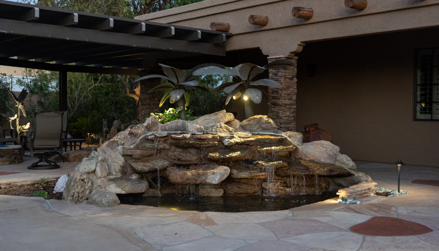 custom water fountain surrounded by stone pavers