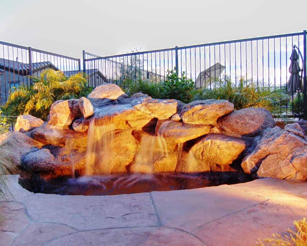 Water feature in backyard at sunset